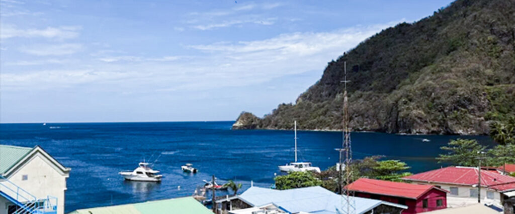 Ocean view in Soufrière, St. Lucia with boats and coastline seen from Felicity Rooftop Restaurant