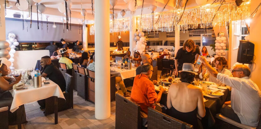 Guests dining at Felicity Rooftop Restaurant in Soufrière St Lucia with elegant décor, lively atmosphere, and rooftop ambiance showcasing the best rooftop dining experience in Soufrière.