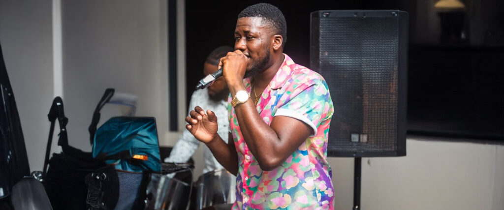 Live singer performing at Felicity Rooftop Restaurant in St Lucia during weekend live music event with vibrant atmosphere.